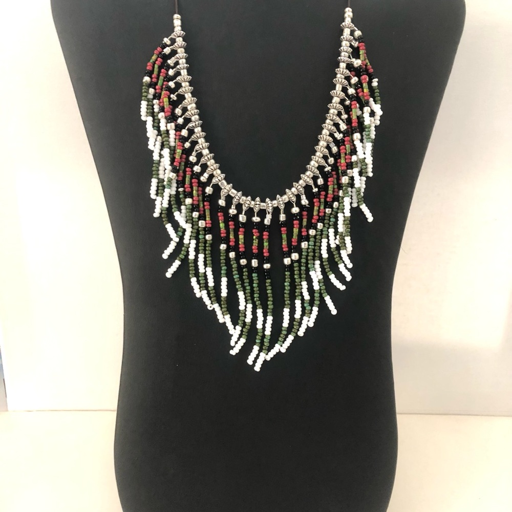 Handmade boho fringed festival beaded necklace in silver, green, and white